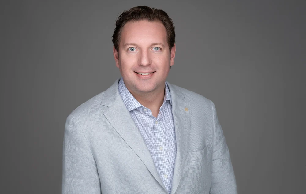 James Ridgway, Jr., in a light gray blazer